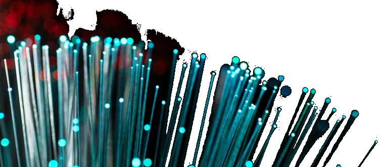 Fibras ópticas iluminadas en azul sobre fondo oscuro